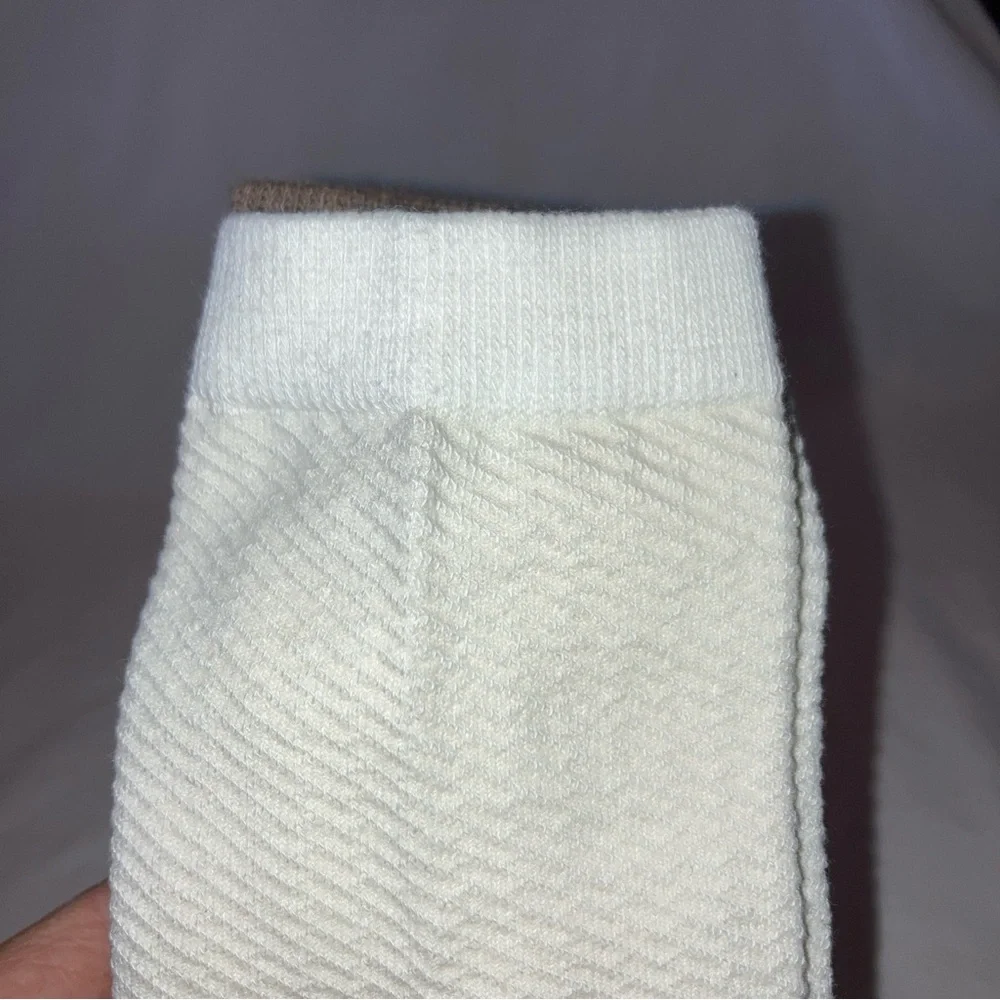 2 packs of A New Day Palm Women’s Print and Solid Brown and cream colored socks.